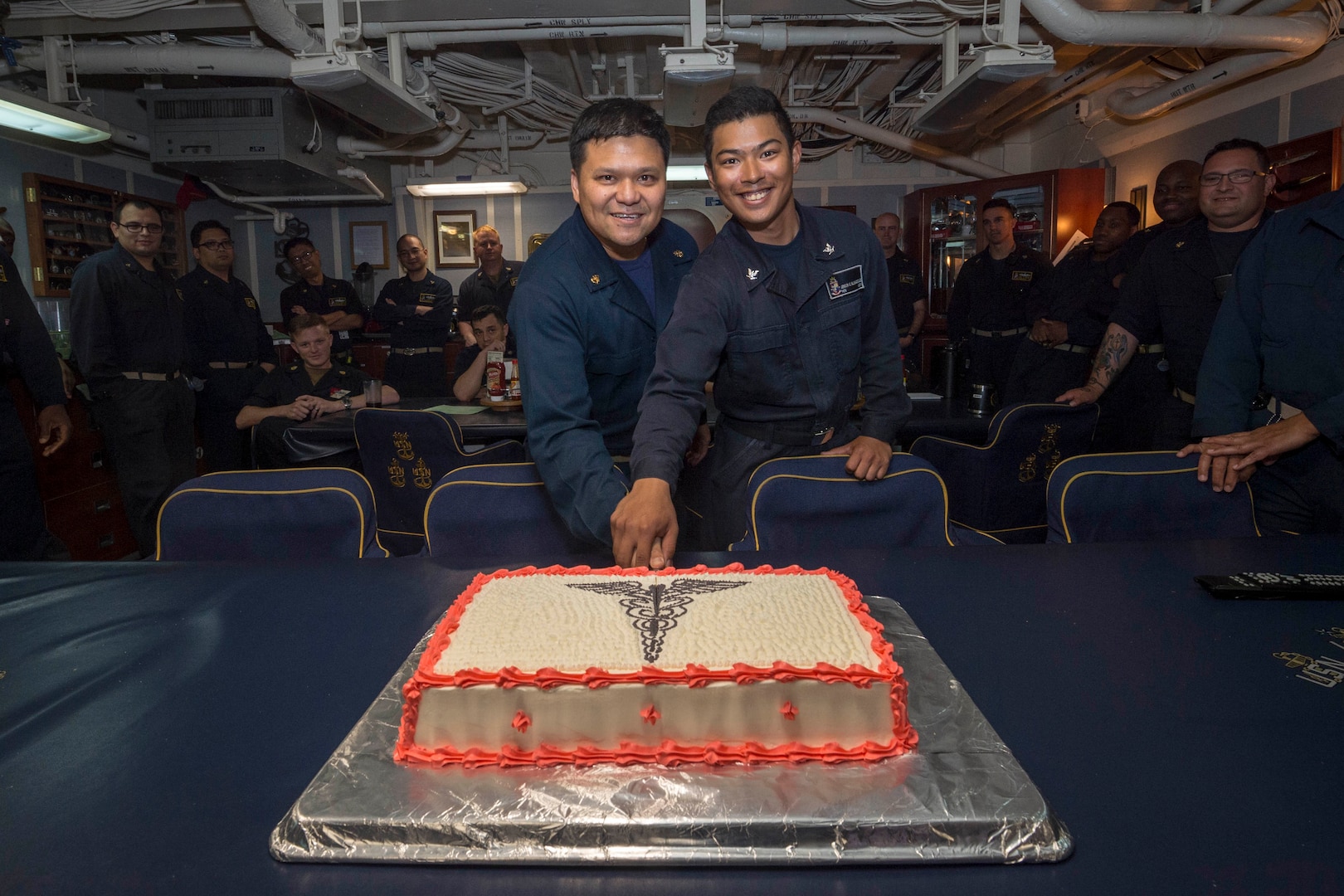 Chief Hospital Corpsman Mark Naluz, from Nashville, Tennessee, and Hospital Corpsman 3rd Class Jenson Yalunggonzales, from Long Beach, California, cut a cake in the Chief Mess on the Ticonderoga-class guided-missile cruiser USS Chancellorsville (CG 62) during a celebration for the Hospital Corpsmen's 120th birthday. The Hospital Corps was officially created on June 17th, 1898, but hospital corpsmen have been serving the U.S. Navy for over 200 years. Chancellorsville is forward-deployed to the U.S. 7th Fleet area of operations in support of security and stability in the Indo-Pacific region.