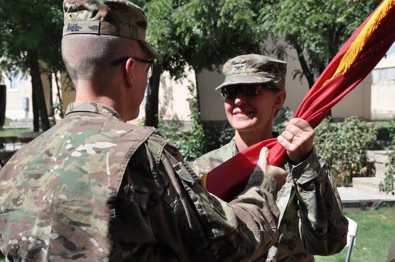 Col. Kimberly Colloton (right) receives the Army Colors from Brig. Gen. David Hill, U.S. Army Corps of Engineers, Transatlantic Division commander, in a change of command ceremony, Aug. 12 at Bagram Airfield, Afghanistan. Colloton became the first female commander of the Transatlantic Afghanistan District sine the district's establishment in 2013.