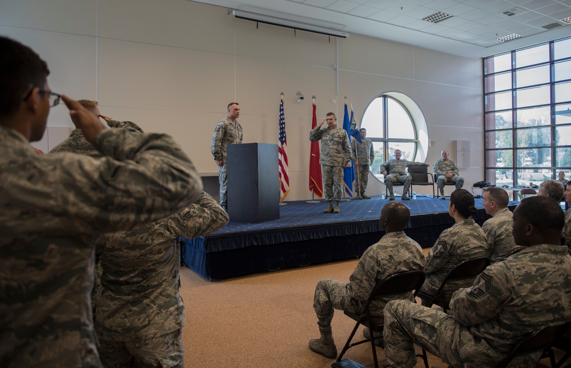 Commander salutes squadron.