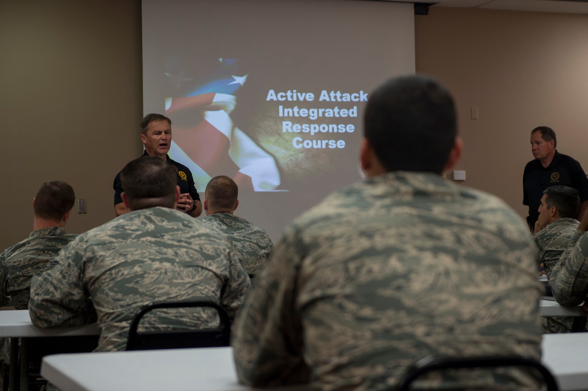 Doug Herrington and Tim Williams, Advanced Law Enforcement Rapid Response Training instructors, teach the classroom portion of their training to first responders of the 97th Air Mobility Wing, June 18, 2018, at Altus Air Force Base, Okla.