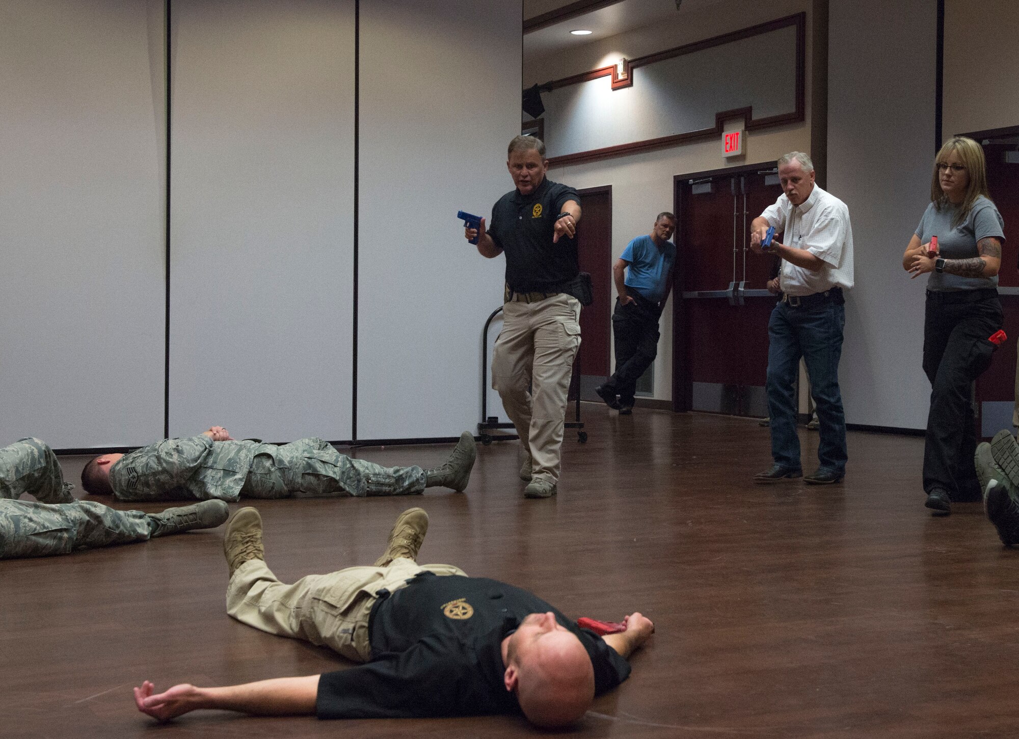 Doug Herrington, Advanced Law Enforcement Rapid Response Training instructor, demonstrates how to take lead in an active shooter response to first responders of the 97th Air Mobility Wing, June 18, 2018, at Altus Air Force Base, Okla.