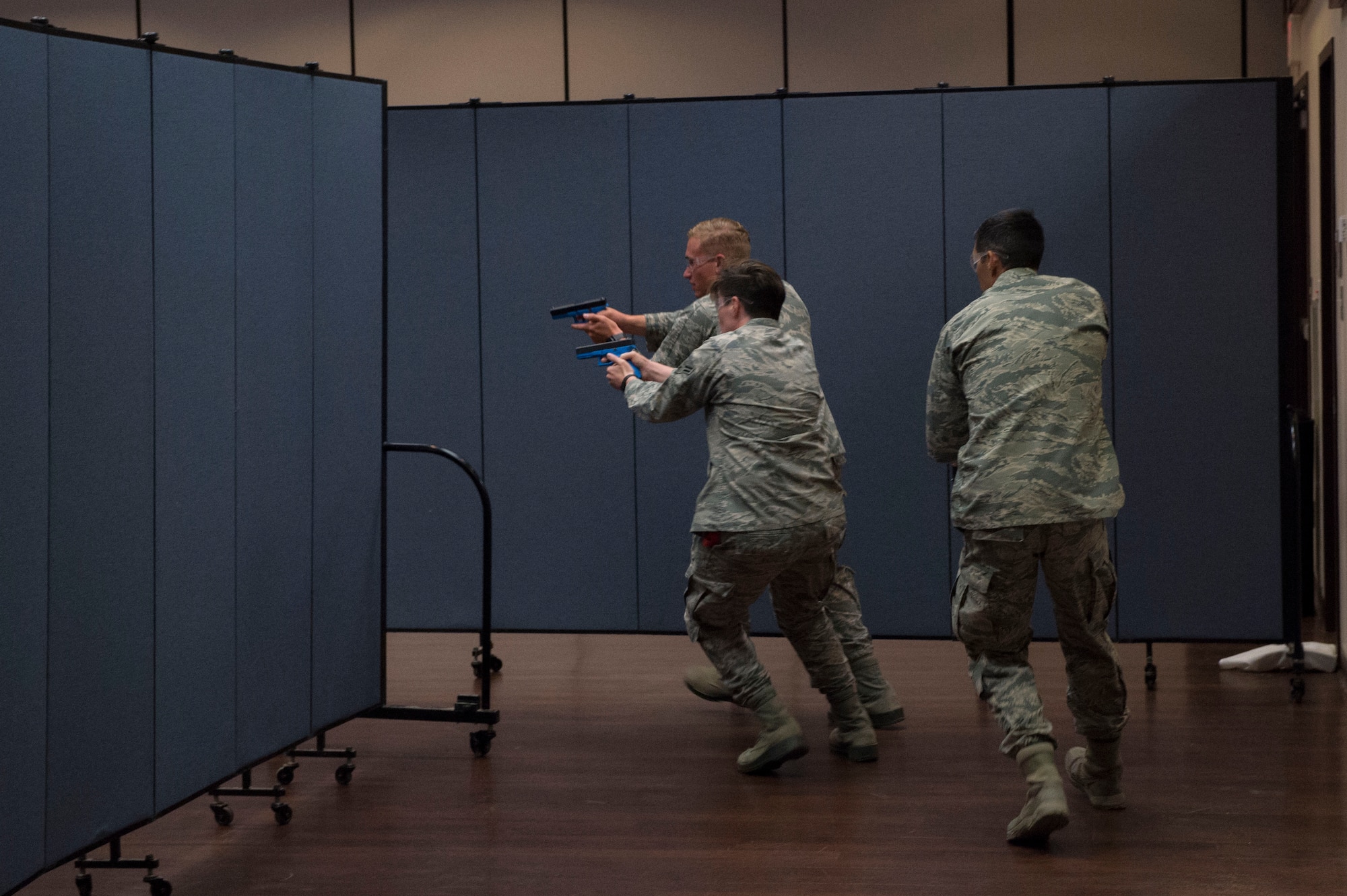 Members of the 97th Security Forces Squadron rush in after they see a suspect of an active shooter situation, during Advanced Law Enforcement Rapid Response Training, June 18, 2018, at Altus Air Force Base, Okla.