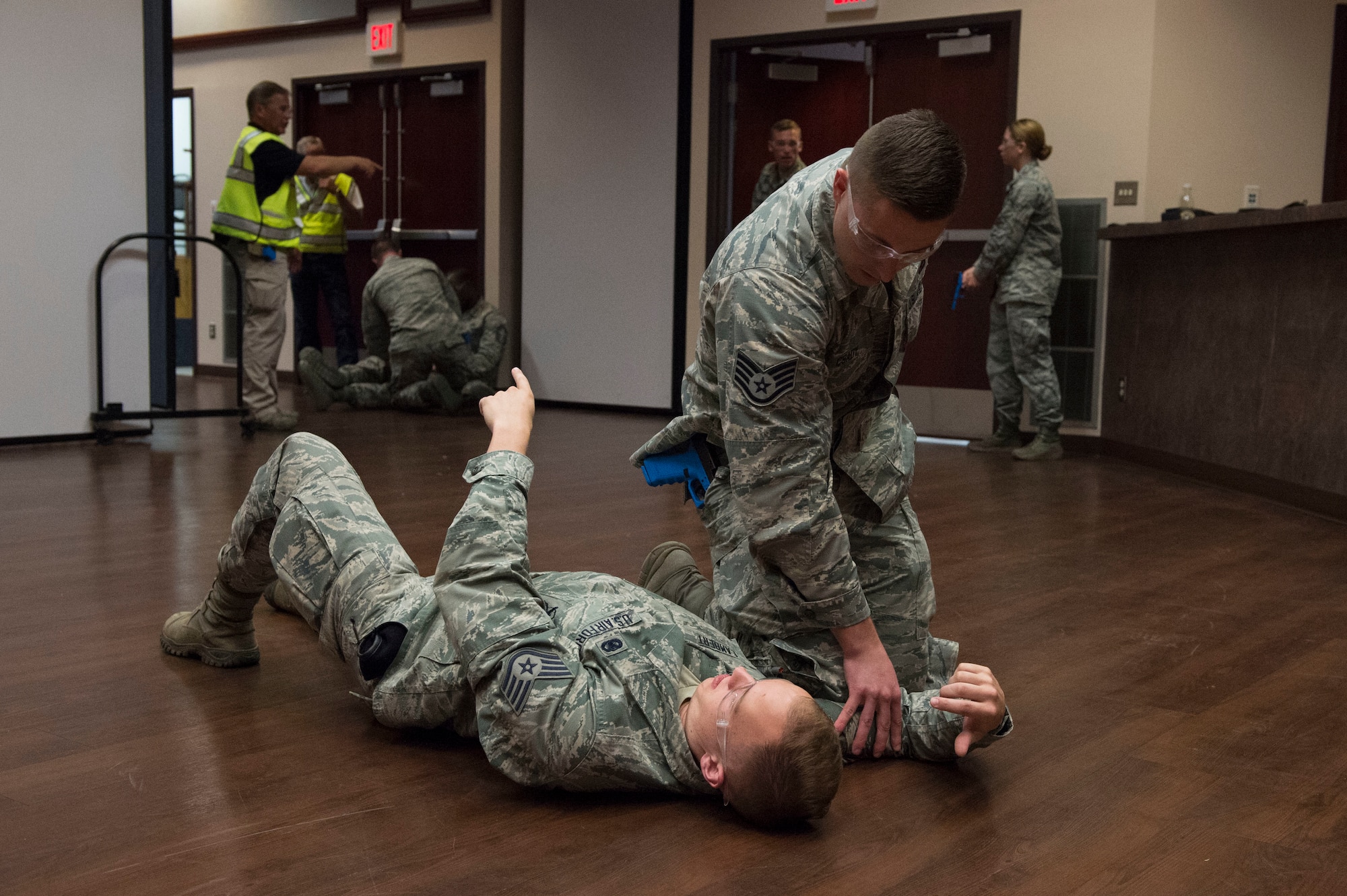 U.S. Air Force Staff Sgt. Brandon Csday, flight sergeant assigned to the 97th Security Forces Squadron, puts pressure on a gunshot victim while the victim gives him information on where the gunman is located, during Advanced Law Enforcement Rapid Response Training, June 18, 2018, at Altus Air Force Base, Okla.