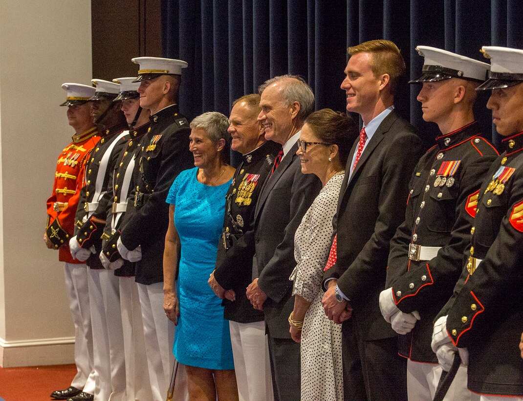 The official party and Barracks Marines pose for a photo during a Friday Evening Indoor Ceremony at Marine Barracks Washington D.C., June 22, 2018. The guest of honor for the ceremony was Secretary of the Navy, Richard V. Spencer, and the hosting official was the Commandant of the Marine Corps, Gen. Robert B. Neller. (Official Marine Corps photo by Sgt. Robert Knapp/Released)