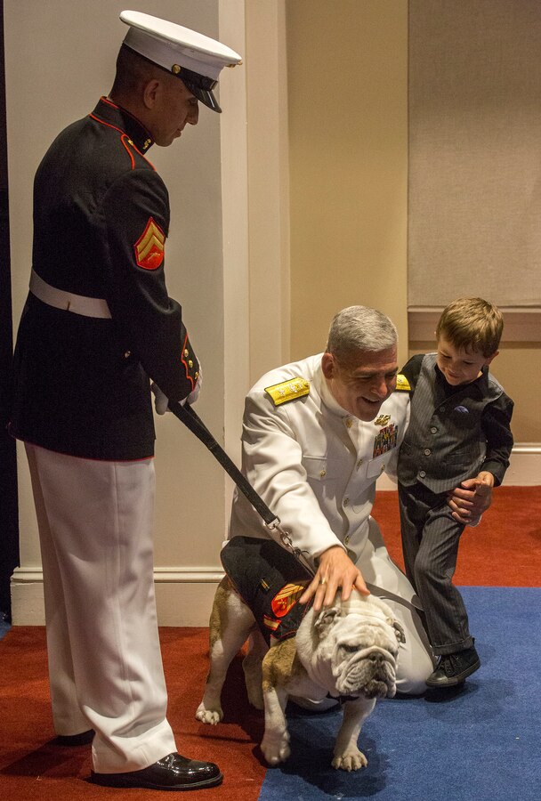 Rear Adm. Gregory N. Todd, 20th Chaplain of the Marine Corps, and his son meet with Sgt. Chesty XV, the official Marine Corps mascot, following a Friday Evening Indoor Ceremony at Marine Barracks Washington D.C., June 22, 2018. The guest of honor for the ceremony was Secretary of the Navy, Richard V. Spencer, and the hosting official was the Commandant of the Marine Corps, Gen. Robert B. Neller. (Official Marine Corps photo by Sgt. Robert Knapp/Released)
