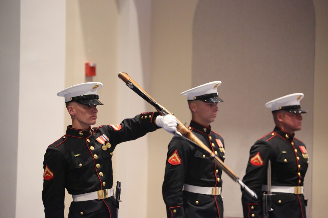 Marines with U.S. Marine Corps Silent Drill Platoon, perform precision rifle drill maneuvers during a Friday Evening Parade at Marine Barracks Washington D.C., June 22, 2018. The guest of honor for the ceremony was the Secretary of the Navy, Richard V. Spencer, and the hosting official was the Commandant of the Marine Corps, Gen. Robert B. Neller.