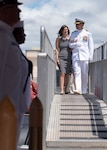 Capt. Robert A. Roncska (Ret.) and his family are piped ashore during the Submarine Squadron 7 change of command and retirement ceremony on the submarine piers in Joint Base Pearl Harbor-Hickam, June 22. (U.S. Navy photo by Mass Communication Specialist 2nd Class Michael H. Lee/Released)