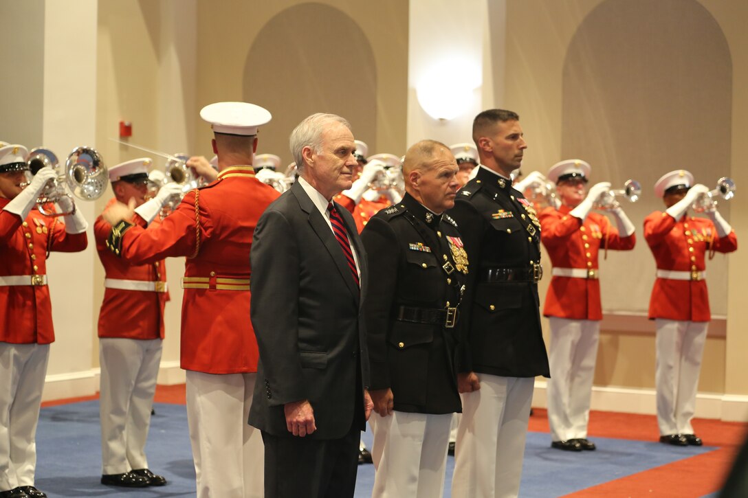 The official party for a Friday Evening Parade renders honors during the ceremony at Marine Barracks Washington D.C., June 22, 2018. The guest of honor for the ceremony was the Secretary of the Navy, Richard V. Spencer, and the hosting official was the Commandant of the Marine Corps, Gen. Robert B. Neller.