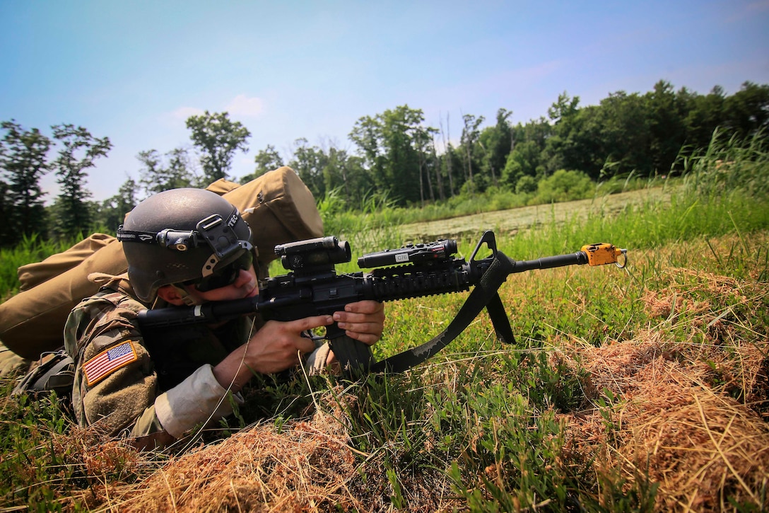 A soldier aims his carbine during training.