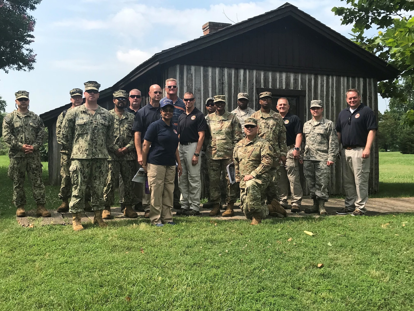 From left: Navy Cmdr. Jody Daniel, Navy Cmdr. Michael Wanger, Navy Lt. Cmdr. David Muhl, Navy Petty Officer 2nd Class Andray Newkirk, Tom Couch, John Foden, Adrienne Smith, Tim Fahey, Tim Collins, Air Force Master Sgt. Edward Johnson, Army Col. Andrea McCollum, Army Maj. Christopher Price, Army Capt. Mihkel Angelo, Army Lt. Col. Edward Brown, Andrew Vickers, Air Force Master Sgt. Christopher Miller and Tim Mark. (Photo by Navy Logistics Specialist 2nd Class Vincent Smith)