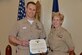 Athens, Ga., native Navy Lt. Matthew Middendorf, left, a physician at Naval Health Clinic Charleston, located at Joint Base Charleston in Goose Creek, S.C., receives a Navy and Marine Corps Achievement Medal from NHCC Executive Officer Capt. Kathleen Hinz during an award ceremony in April. Middendorf was recently named NHCC’s Provider of the Year.