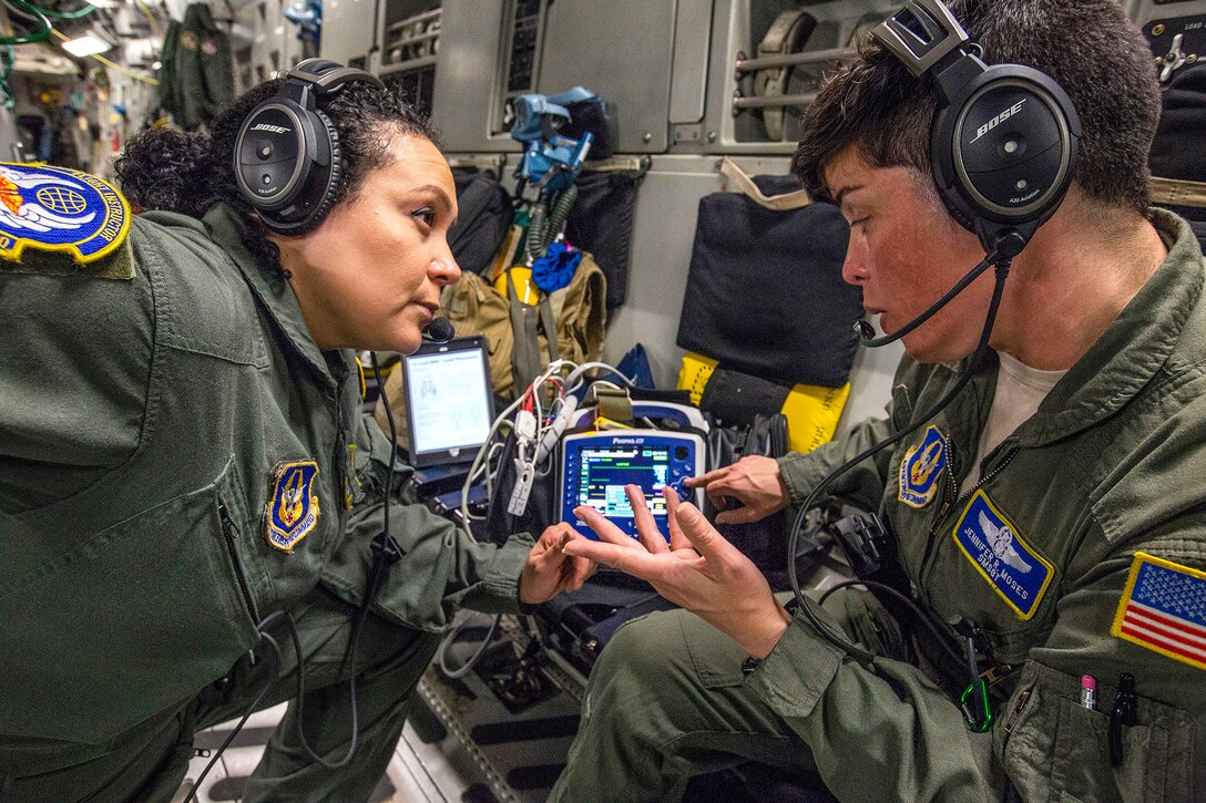 Airmen review procedures for using the vital signs monitor/defibrillator.