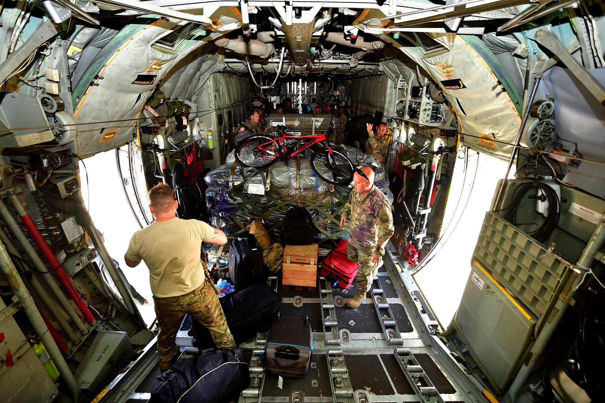 166th AW Airmen organize duty and personal equipment for deploying ANG members at New Castle Air National Guard Base, Del., June 25, 2018. Deployments offer an active-duty experience to traditional ANG members, as many ANG members serve one weekend per month and two weeks out of the year. (U.S. Air National Guard photo by Staff Sgt. John Michaels)