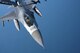 A U.S. Air Force pilot assigned to the 77th Fighter Squadron navigates an F-16CM Fighting Falcon over the Atlantic Ocean while being refueled by a 72nd Air Refueling Squadron KC-135R Stratotanker, June 20, 2018.