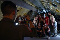 U.S. Airmen assigned to the 20th Fighter Wing (FW) and Team Shaw spouses gather for a photo in a 72nd Air Refueling Squadron KC-135R Stratotanker during an incentive flight over the Atlantic Ocean, June 20, 2018.