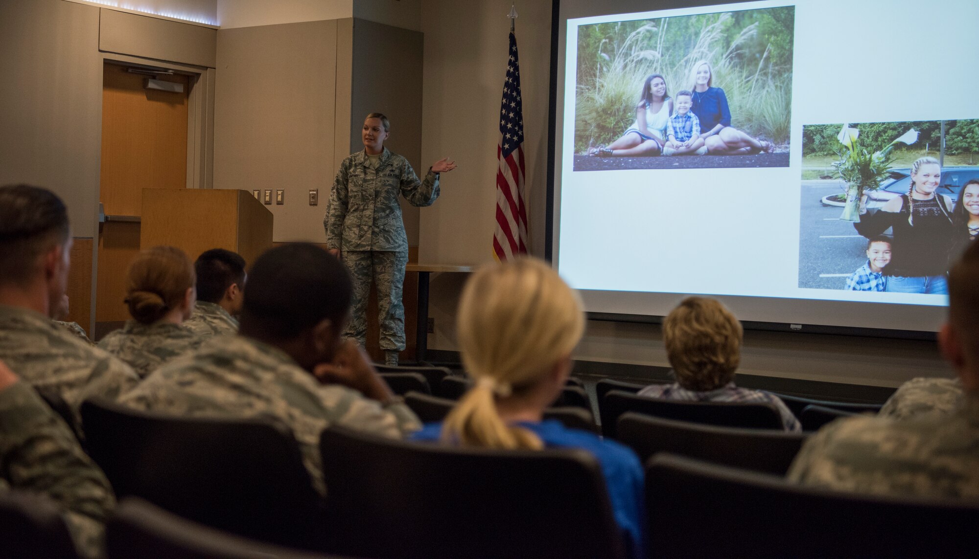 U.S. Air Force Master Sgt. Michelle Humphrey, 87th Air Base Wing first sergeant, speaks during the Storytellers convention on Joint Base McGuire-Dix-Lakehurst, N.J., June 20, 2018. Humphrey showed pictures of her children while she explained how she survived the abuse that almost killed her by the hands of her childrens’ father.  (U.S. Air Force photo by Airman Ariel Owings)