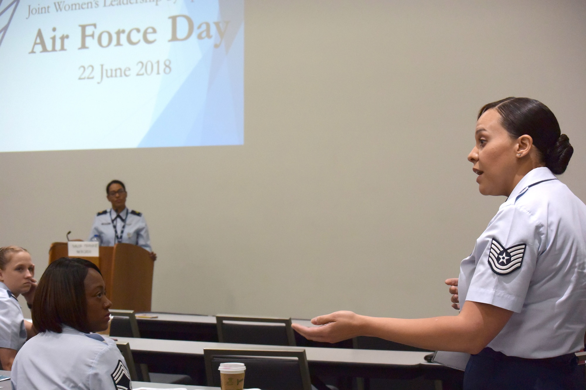An attendee shares their experience at the 2018 Joint Women's Leadership Symposium June 22, 2018, in San Diego, Calif. This year’s theme “The Power Within You” featured practical workshops, joint discussion boards, an international speakers panel and service specific breakout sessions intended to promote personal and professional development. (U.S. Air Force photo by 1st Lt. Annabel Monroe)