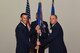 U.S. Air Force Col. Jason Beck, 17th Mission Support Group commander, accepts the 17th Contracting Squadron guideon from Lt. Col. John Travieso, 17th CONS outgoing commander, during the 17th CONS Change of Command ceremony at the Event Center on Goodfellow Air Force Base, Texas, June 25, 2018. The change of command ceremony is a time honored military tradition that signifies the orderly transfer of authority. (U.S. Air Force photo by Airman 1st Class Zachary Chapman/Released)