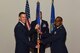 U.S. Air Force Col. Jason Beck, 17th Mission Support Group commander, passes the 17th Contracting Squadron guideon to Maj. Michael Quinn, 17th CONS incoming commander, at the 17th CONS Change of Command ceremony at the Event Center on Goodfellow Air Force Base, Texas, June 25, 2018. The guideon signifies the passing of command from one commander to the next. (U.S. Air Force photo by Airman 1st Class Zachary Chapman/Released)