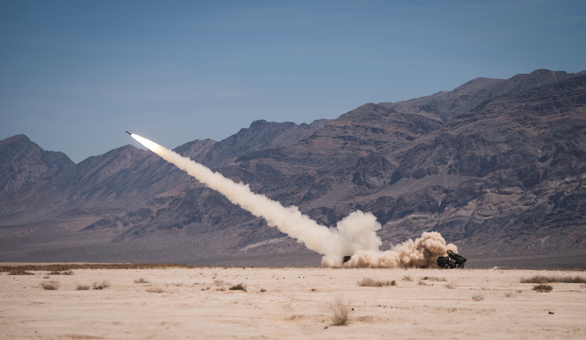 An M142 High Mobility Artillery Rocket System (HIMARS) assigned to 3rd Battalion, 321st Field Artillery Regiment, Fort Bragg, North Carolina, launches artillery at the Nevada Test and Training Range, June 9, 2018. The HIMARS is capable of being transported in anything from a C-130 Hercules cargo aircraft to a C-5 Galaxy cargo aircraft. (U.S. Air Force photo by Airman 1st Class Andrew D. Sarver)