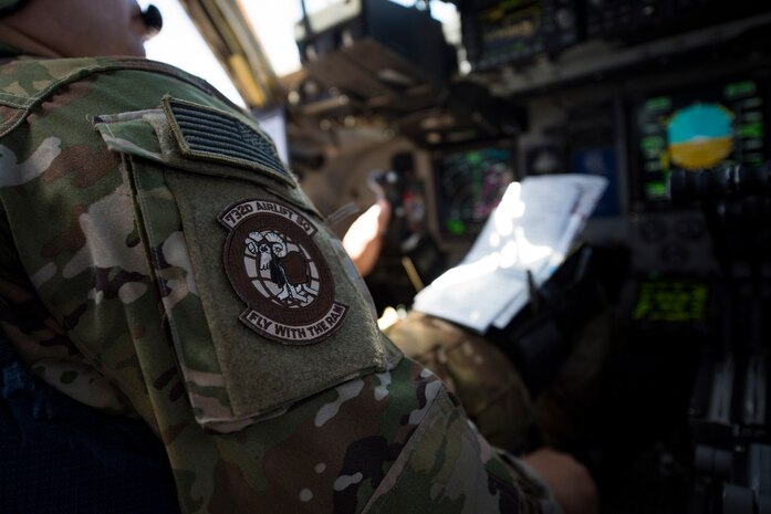 Maj. David Rodriguez, 732nd Airlift Squadron Instructor Pilot, flies a C-17 Globemaster III cargo aircraft over the Nevada Test and Training Range, June 9, 2018. The C-17 landed on a dry lake bed after performing low-altitude evasive maneuvers. (U.S. Air Force photo by Airman 1st Class Andrew D. Sarver)