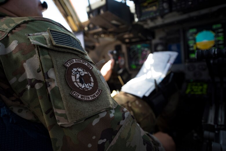 Maj. David Rodriguez, 732nd Airlift Squadron Instructor Pilot, flies a C-17 Globemaster III cargo aircraft over the Nevada Test and Training Range, June 9, 2018. The C-17 landed on a dry lake bed after performing low-altitude evasive maneuvers. (U.S. Air Force photo by Airman 1st Class Andrew D. Sarver)