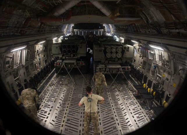 Loadmasters perform pre-flight checks in a C-17 Globemaster III cargo aircraft on the Nevada Test and Training Range, June 9, 2018. The C-17 transported two M142 High Mobility Artillery Rocket Systems as part of a joint forcible training exercise. (U.S. Air Force photo by Airman 1st Class Andrew D. Sarver)