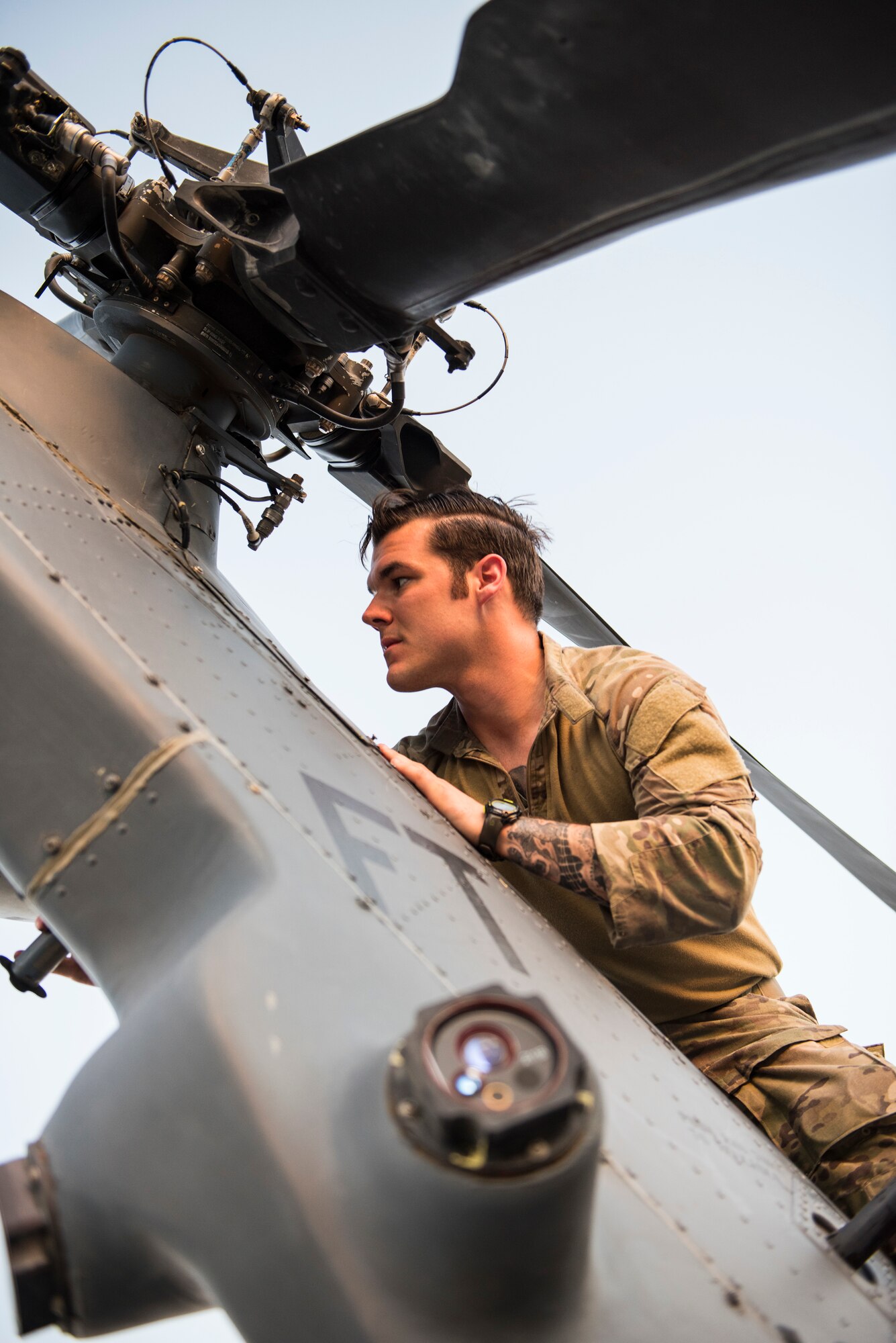 Staff Sgt. Joshua Boehnlein, a special missions aviator assigned to the 56th Rescue Squadron, Aviano Air Base, Italy, inspects tail rotor components on an HH-60G Pave Hawk helicopter June 11, 2018 at Nellis Air Force Base, Nev. Boehnlein was preparing the aircraft for a large-scale U.S. Air Force Weapons School Integration Phase training exercise. (U.S. Air Force photo by Staff Sgt. Joshua Kleinholz)