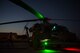 A crew prepares an HH-60G Pave Hawk helicopter prior to a large-scale U.S. Air Force Weapons School Integration Phase training exercise June 11, 2018 at Nellis Air Force Base, Nev. The USAFWS trains tactical experts and leaders to control and exploit air, space and cyberspace assets on behalf of the joint force. (U.S. Air Force photo by Staff Sgt. Joshua Kleinholz)