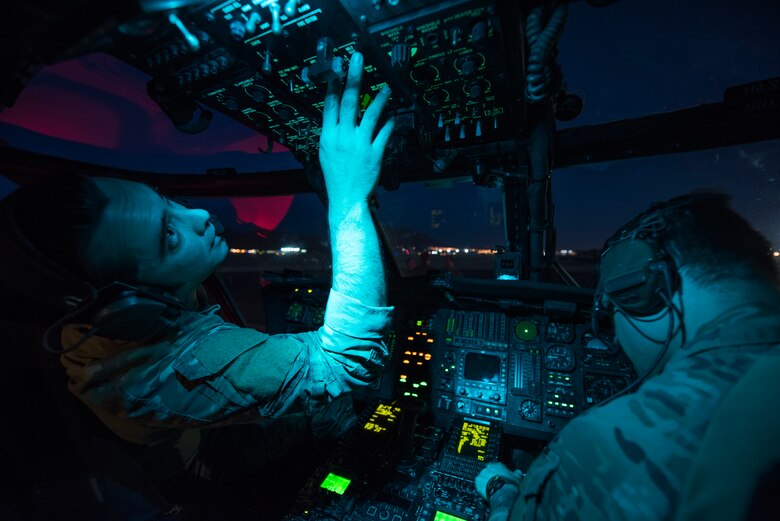 Tech Sgt. Jeremy Sutter, a special missions aviator assigned to the 34th Weapons Squadron, runs avionics checks on an HH-60G Pave Hawk helicopter June 11, 2018 at Nellis Air Force Base, Nev. The crew was preparing for a U.S. Air Force Weapons School training scenario which tasked them with locating, recovering and providing initial medical treatments for a downed pilot. (U.S. Air Force photo by Staff Sgt. Joshua Kleinholz)