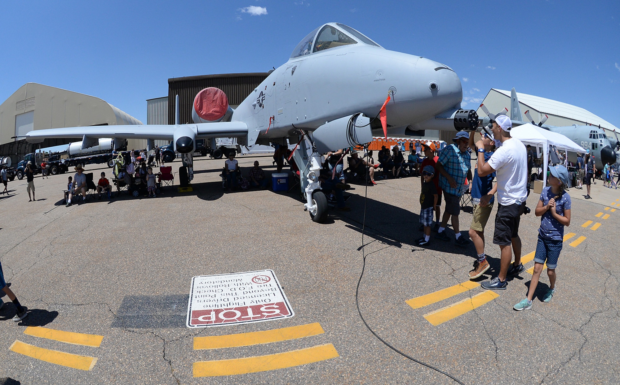 Air show visitors check out an A-10 Thunderbolt II during the Warriors over the Wasatch Air and Space Show June 23, 2018, at Hill Air Force Base, Utah. (U.S. Air Force photo by Alex R. Lloyd)