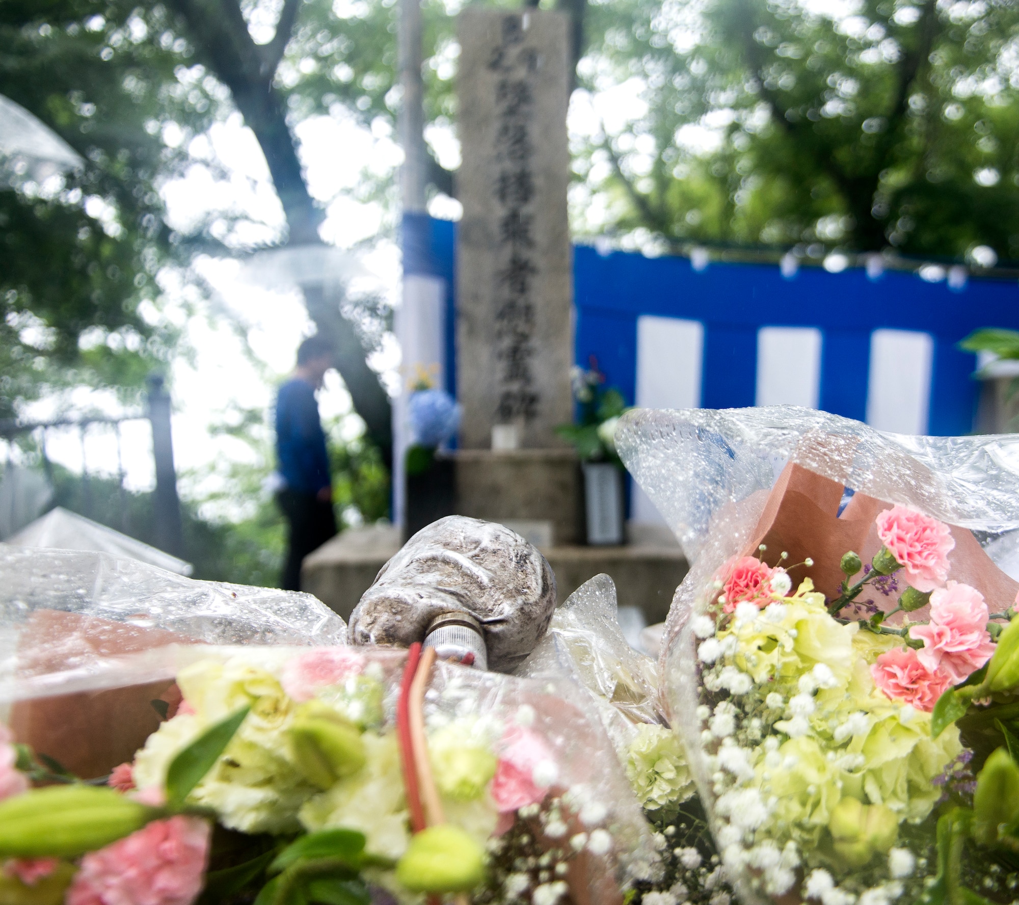 Flowers and whiskey are placed by the B-29 Memorial during a ceremony