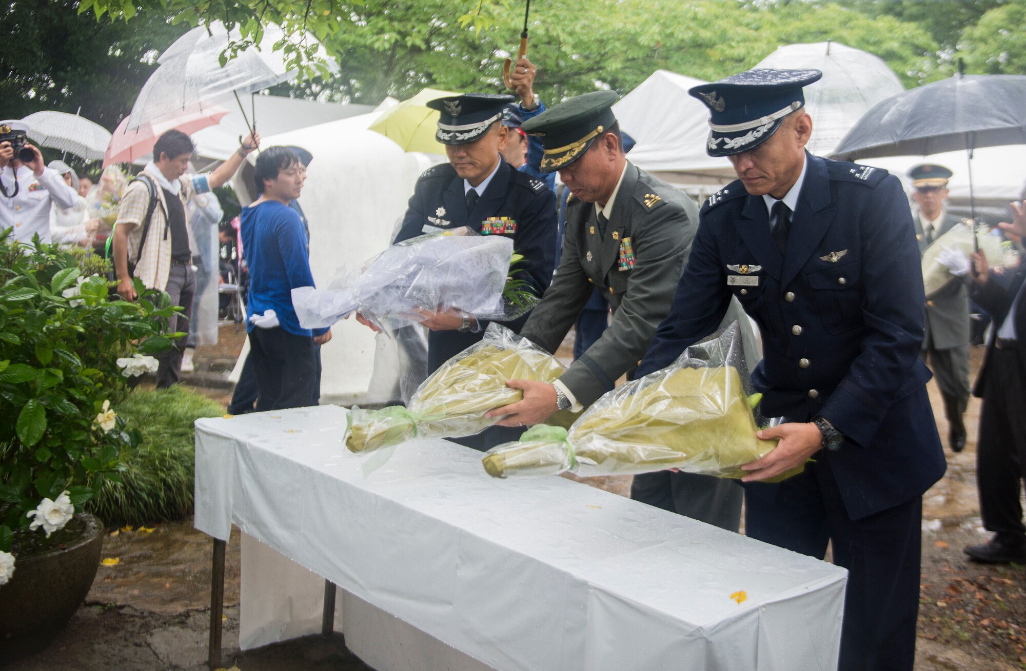 Japanese military leadership present flowers