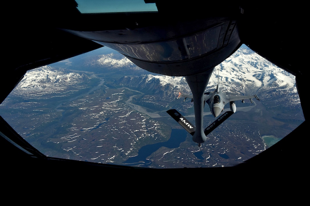 An Air Force F-16 Fighting Falcon approaches a KC-135 Stratotanker to receive fuel