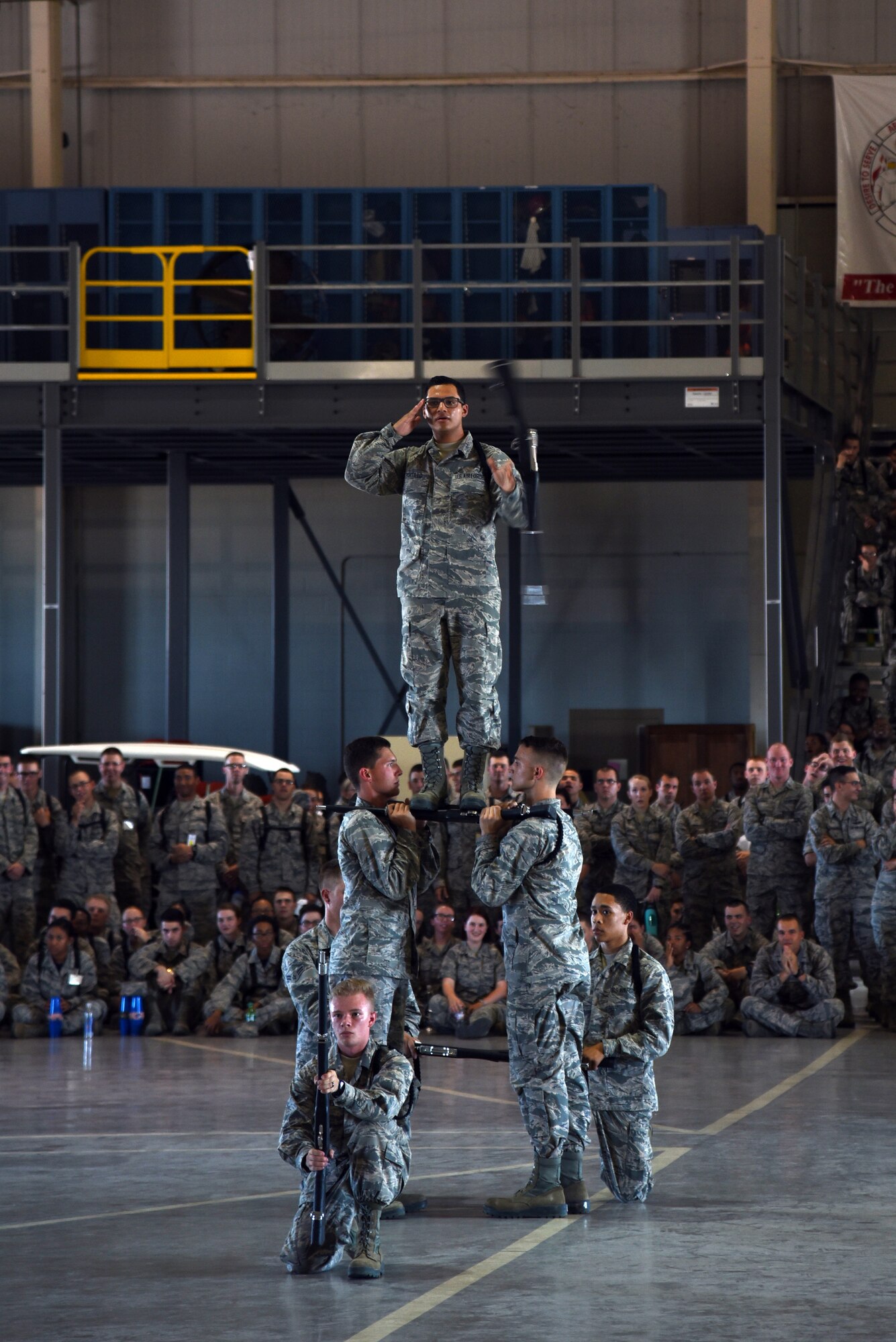 U.S. Air Force Airman 1st Class Erin Portillo, 316th Training Squadron trainee, salutes at the end of his and his team’s exhibition drill portion of the 17th Training Group drill competition at the Louis F. Garland Department of Defense Fire Academy on Goodfellow Air Force Base, Texas, June 22, 2018. The 316th TRS won the exhibition portion and placed first overall at the drill competition. (U.S. Air Force photo by Staff Sgt. Joshua Edwards/Released)