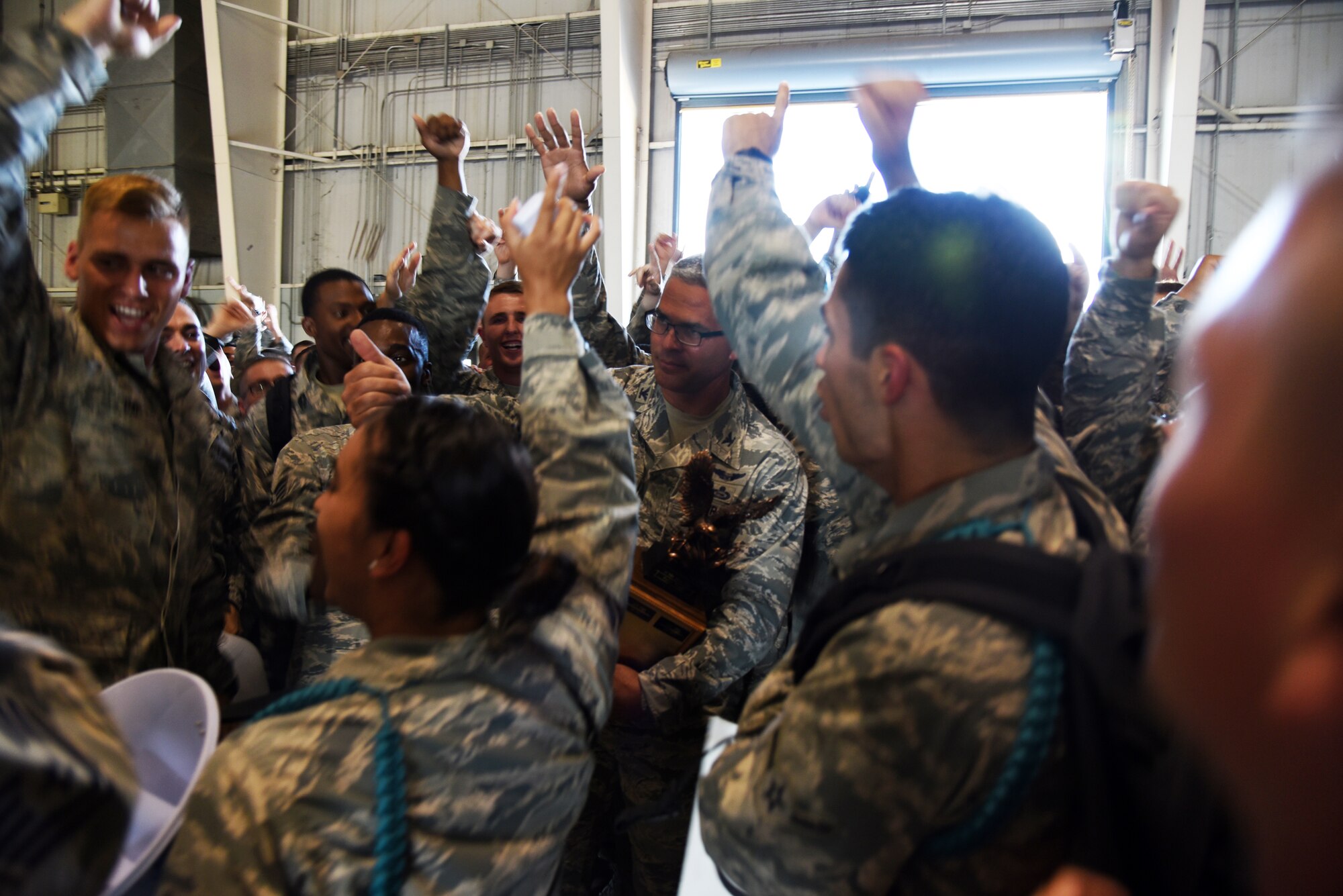 U.S. Air Force Col. Alex Ganster, 17th Training Group commander, presents the spirit award to the 312th Training Squadron during the 17th TRG drill competition at the Louis F. Garland Department of Defense Fire Academy on Goodfellow Air Force Base, Texas, June 22, 2018. The spirit award goes to the squadron with the best participation during the drill competition. (U.S. Air Force photo by Staff Sgt. Joshua Edwards/Released)