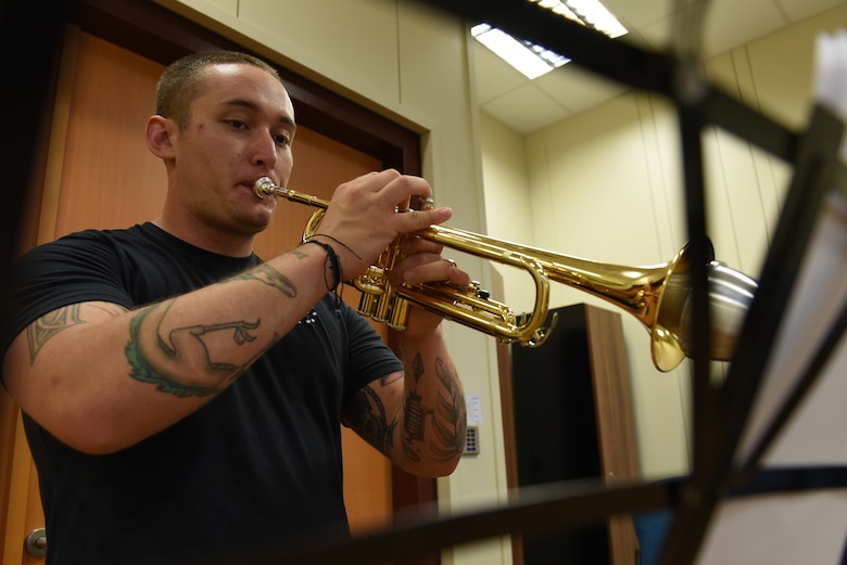 U.S. Air Force Staff Sgt. Matthew Andrews, 39th Force Support Squadron NCO in charge of the Community Center, practices playing his trumpet in the Community Center at Incirlik Air Base, Turkey, June 18, 2018.