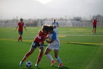 FORT BLISS, Texas. –  U.S. Air Force Staff Sgt. AJ Cibulsky battles China's Cadet Lyu Yuting for possession of the ball at the 2018 Conseil International du Sport Militaire (CISM) World Military Women’s Football Championship at Fort Bliss’ Stout Field June 24. International military teams squared off to eventually crown the best women soccer players among the international militaries participating. U.S. Navy photo by Mass Communication Specialist 3rd Class Camille Miller (Released)