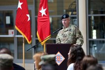 Soldier speaking at podium