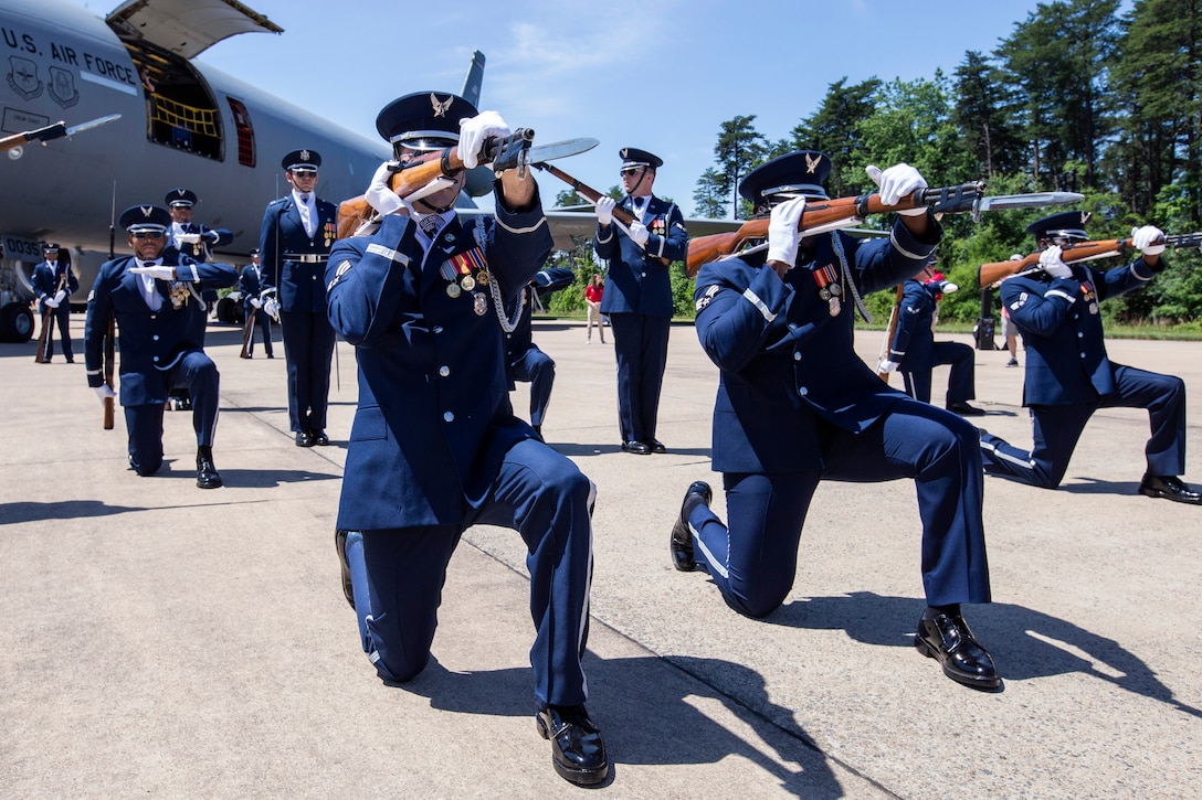 The Air Force Honor Guard Drill Team performs weapon maneuvers.