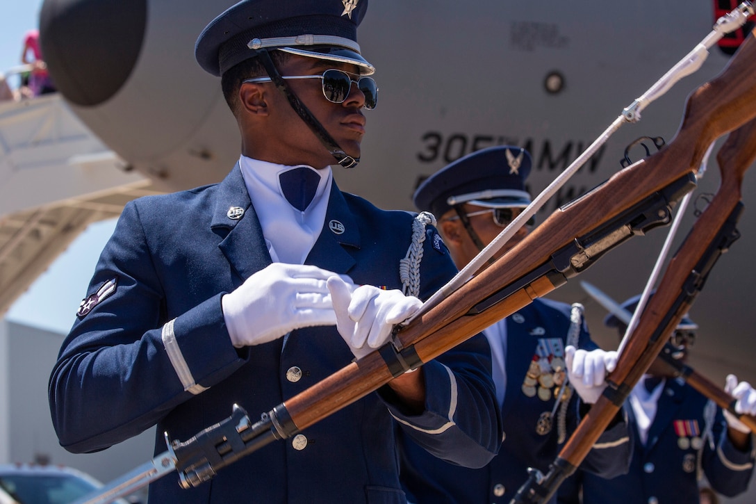 Air Force airman performs weapon maneuvers at the Innovations in Flight Family Day and Outdoor Aviation Display.