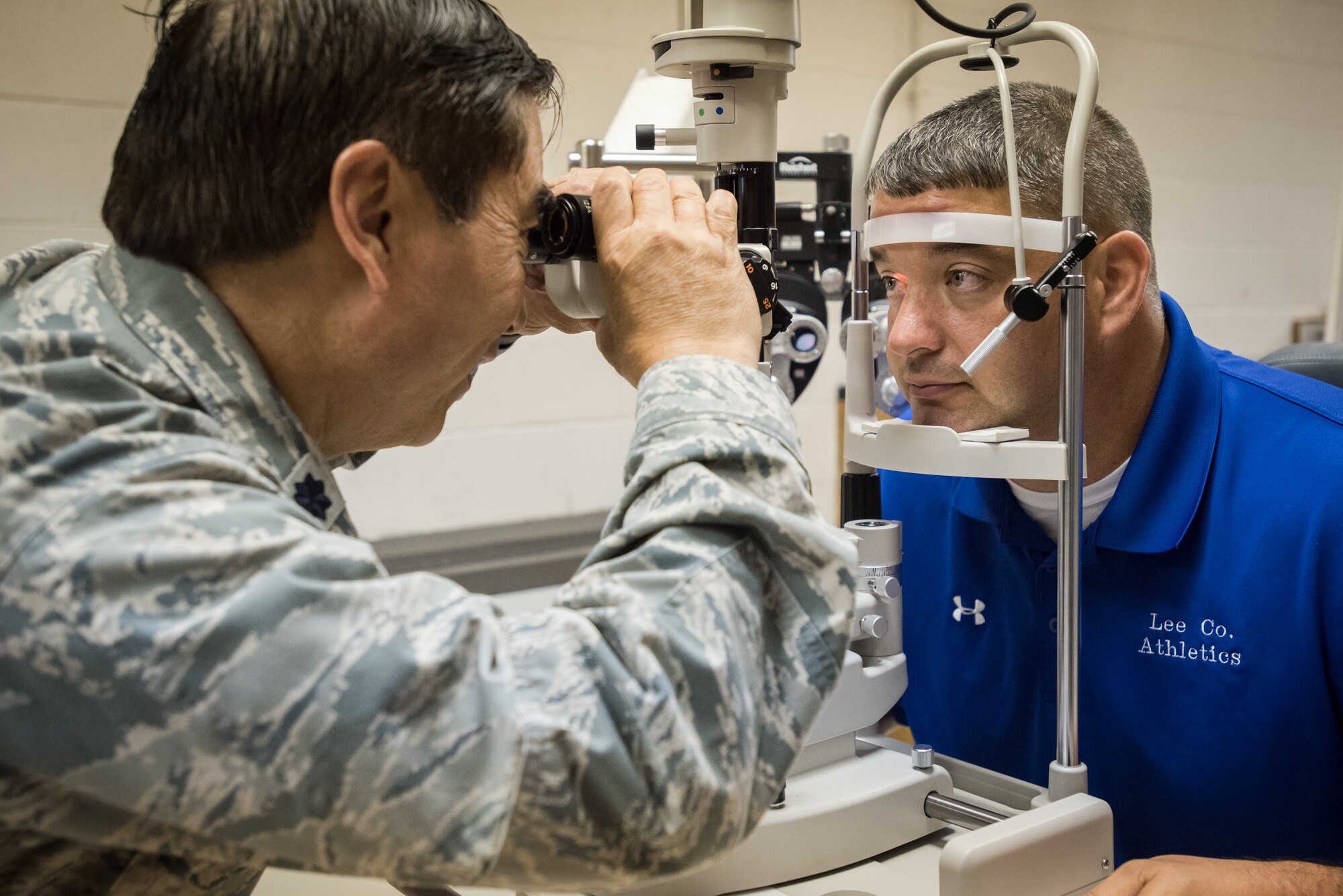 U.S. Air Force Lt. Col. Ronald Short, an optometrist from the California Air National Guard’s 163rd Attack Wing, conducts an eye exam on a local resident at a no-cost health-care clinic at Lee County High School in Beattyville, Ky., June 15, 2018. The clinic is one of four that was staffed by military health-care professionals in Eastern Kentucky from June 15 to June 24 as part of an Innovative Readiness Training mission called Operation Bobcat. The mission provided military forces with crucial expeditionary training while offering no-cost medical, dental and optometry care to area residents. (U.S. Air National Guard photo by Lt. Col. Dale Greer)