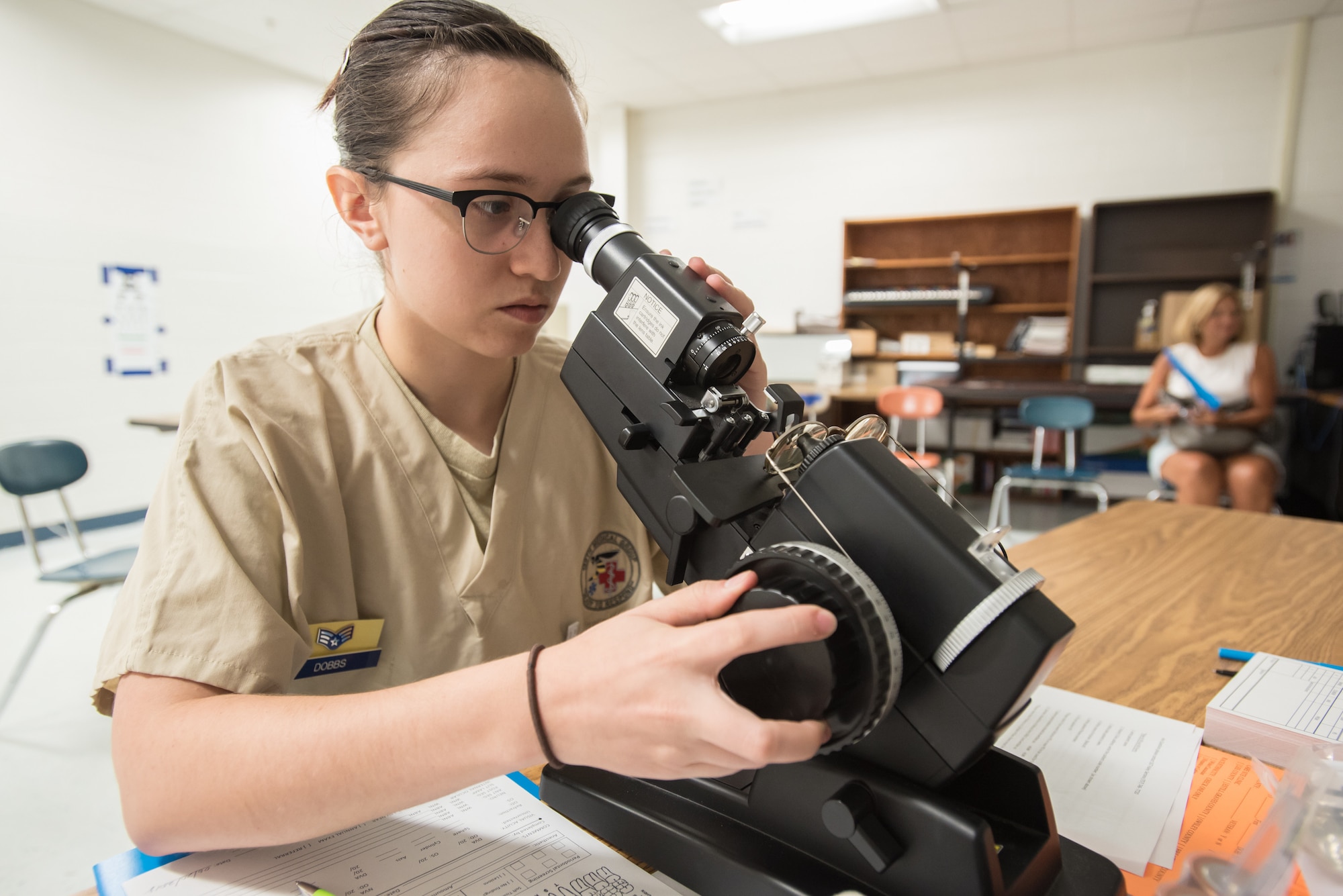 U.S. Air Force Senior Airman Kathryn Dobbs, a medic from the Ohio Air National Guard’s 180th Fighter Wing, checks the prescription of an optometry patient’s eyeglasses at a health-care clinic being operated by the Air Guard and U.S. Navy Reserve at Breathitt County High School in Jackson, Ky., June 20, 2018. The Jackson clinic is one of four that comprised Operation Bobcat, a 10-day mission to provide military medical troops with crucial training in field operations and logistics while offering no-cost health care to the residents of Eastern Kentucky. The clinics, which operated from June 15-24, offered non-emergent medical care; sports physicals; dental cleanings, fillings and extractions; eye exams and no-cost prescription eye glasses. (U.S. Air National Guard photo by Lt. Col. Dale Greer)