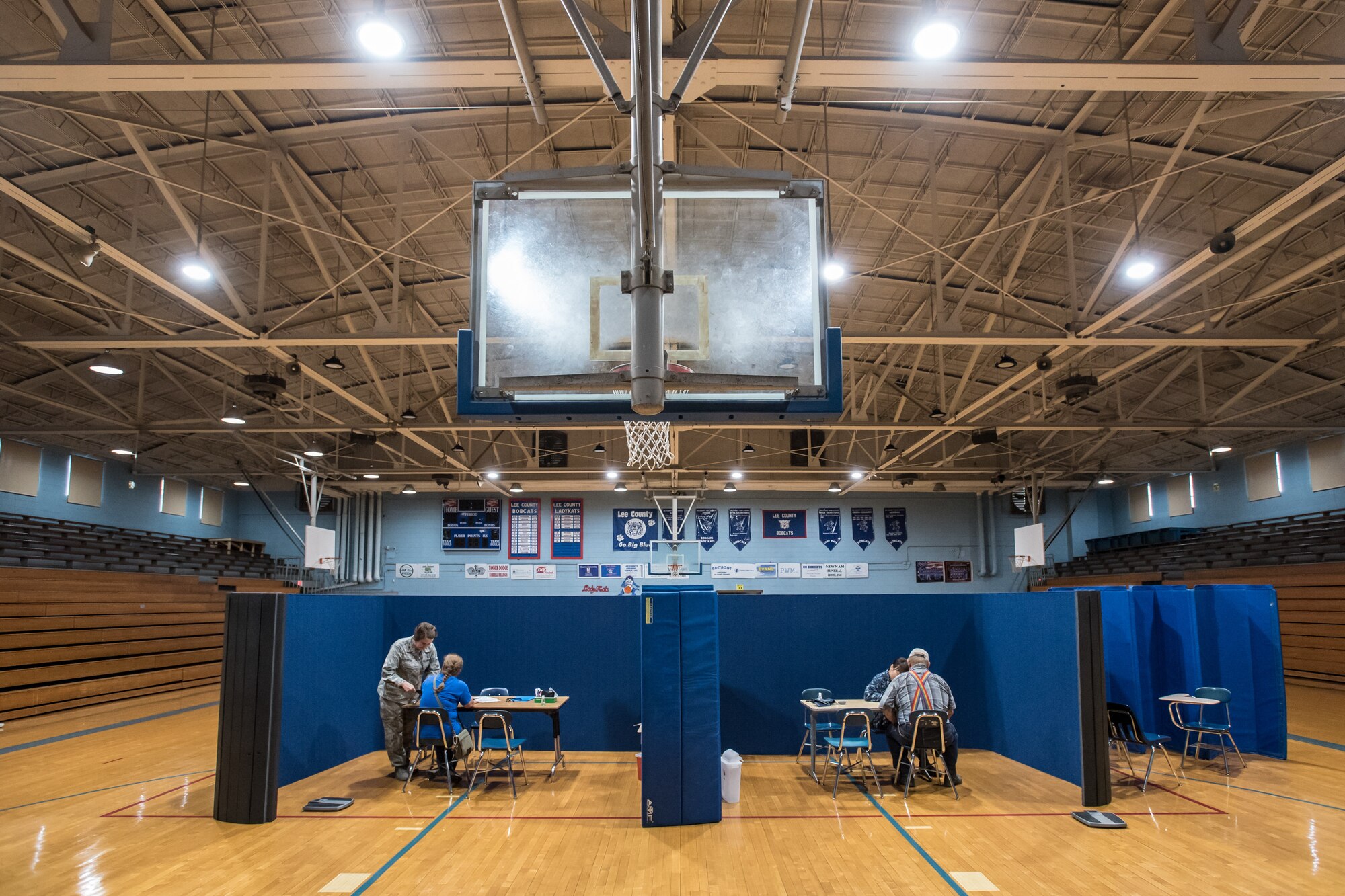 Area residents meet with medics in the gymnasium at Lee County High School in Beattyville, Ky., June 21, 2018, prior to receiving treatment at a health-care clinic being operated by the Air National Guard and U.S. Navy Reserve June 20, 2018. The clinic is one of four that comprised Operation Bobcat, a 10-day mission to provide military medical troops with crucial training in field operations and logistics while offering no-cost health care to the residents of Eastern Kentucky. The clinics, which operated from June 15-24, offered non-emergent medical care; sports physicals; dental cleanings, fillings and extractions; eye exams and no-cost prescription eye glasses. (U.S. Air National Guard photo by Lt. Col. Dale Greer)