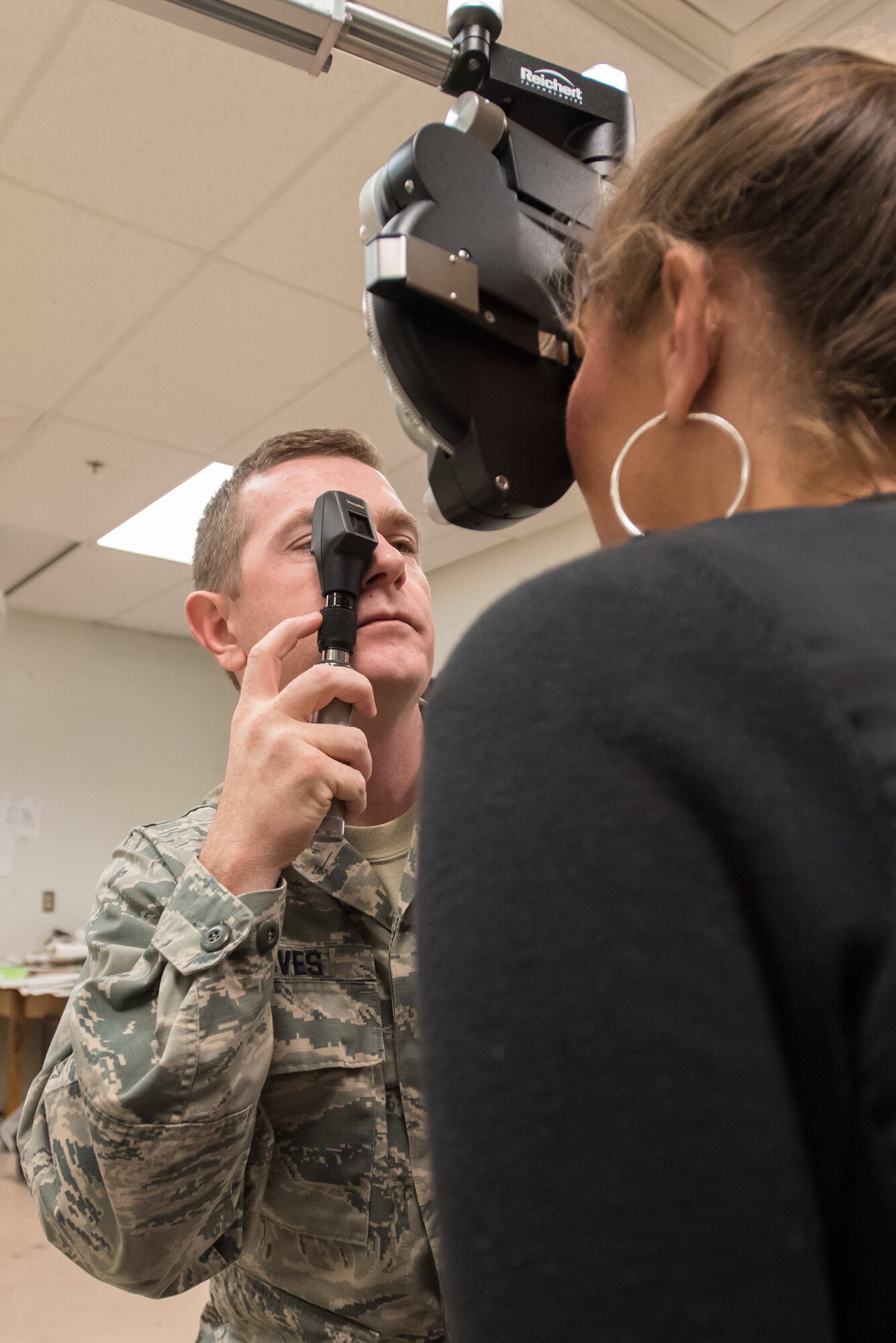 U.S. Air Force Maj. Robert Groves, an optometrist from the New Hampshire Air National Guard’s 157th Air Refueling Wing, examines a patient’s eyes at a health-care clinic being operated by the Air Guard and U.S. Navy Reserve at Estill County High School in Irvine, Ky., June 21, 2018. The clinic is one of four that comprised Operation Bobcat, a 10-day mission to provide military medical troops with crucial training in field operations and logistics while offering no-cost health care to the residents of Eastern Kentucky. The clinics, which operated from June 15-24, offered non-emergent medical care; sports physicals; dental cleanings, fillings and extractions; eye exams and no-cost prescription eye glasses. (U.S. Air National Guard photo by Lt. Col. Dale Greer)