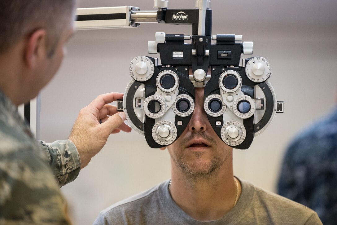 U.S. Air Force Maj. Brett Ringger, an optometrist from the Texas Air National Guard’s 136th Airlift Wing, tests a patient’s vision at a health-care clinic being operated by the Air National Guard and U.S. Navy Reserve at Lee County High School in Beattyville, Ky., June 23, 2018. The clinic is one of four that comprised Operation Bobcat, a 10-day mission to provide military medical troops with crucial training in field operations and logistics while offering no-cost health care to the residents of Eastern Kentucky. The clinics, which operated from June 15-24, offered non-emergent medical care; sports physicals; dental cleanings, fillings and extractions; eye exams and no-cost prescription eye glasses. (U.S. Air National Guard photo by Lt. Col. Dale Greer)