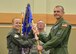 Lt. Col. Kevin Byrd, right, accepts command of the 10th Missile Squadron from Col. Anita Feugate Opperman, 341st Operations Group commander during a change of command ceremony June 21, 2018, at the Grizzly Bend on Malmstrom AFB, Mont.
