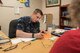 U.S. Navy HM3 Troy Ebbings, a corpsman from Expeditionary Medical Facility Great Lakes in Illinois, fills out an order for eyeglasses at a health-care clinic at Owsley County High School in Booneville, Ky., June 24, 2018. The clinic is one of four that comprised Operation Bobcat, a 10-day mission to provide military medical troops with crucial training in field operations and logistics while offering no-cost health care to the residents of Eastern Kentucky. The clinics, which operated from June 15-24, offered non-emergent medical care; sports physicals; dental cleanings, fillings and extractions; eye exams and no-cost prescription eye glasses. (U.S. Air National Guard photo by Lt. Col. Dale Greer)
