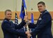 Lt. Col. Alan Haedge, right, accepts command of the 341st Communications Squadron from Col. Marcus Glenn, 341st Mission Support Group commander during a change of command ceremony June 25, 2018, at the Grizzly Bend on Malmstrom AFB, Mont.