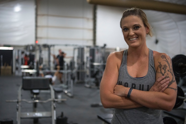 Master Sgt. Nikki Walberg, 386th Air Expeditionary Wing paralegal, stands in the tent gym at an undisclosed location in Southwest Asia, June 18, 2018. Walberg has lost 26 pounds and 5.5 inches off of her waist during her deployment. (U.S. Air Force photo by Staff Sgt. Joshua King)